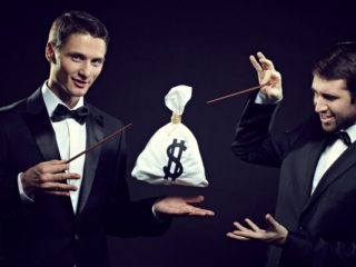 Two wizards performing magic with money bag